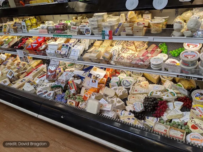 State Street Fruit Store cheese case with various cheeses